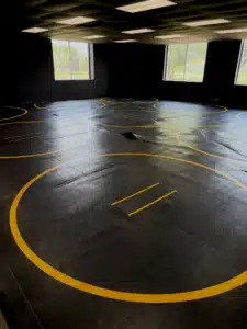 New wrestling mats at black flag jiu-jitsu give athletes more room to train